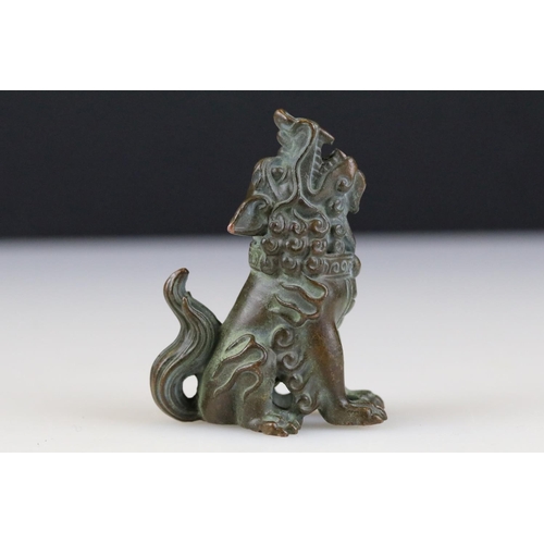 317 - A Chinese ornamental bronze dog of faux statue.
