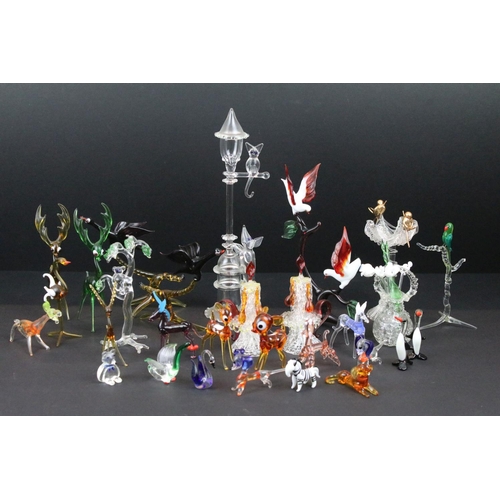 83 - Over 30 Murano glass figures to include Doves, Swans, Dogs, Deer and many more