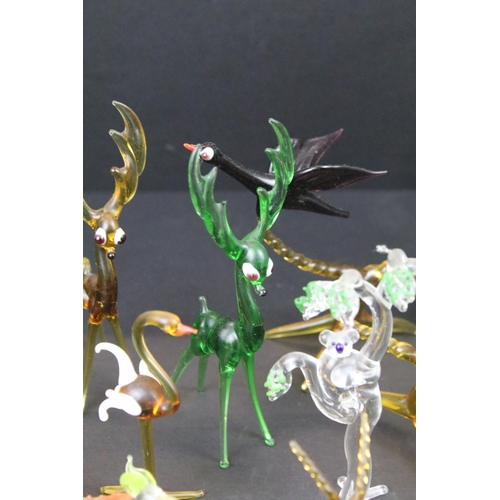 83 - Over 30 Murano glass figures to include Doves, Swans, Dogs, Deer and many more