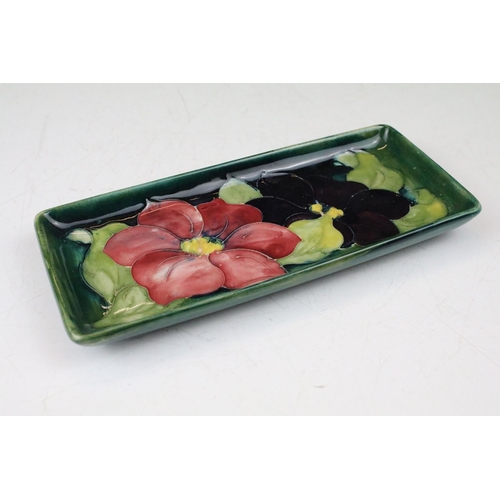 86 - Moorcroft Clematis pattern green ground rectangular tray, label to reverse, approx 20.5cm long