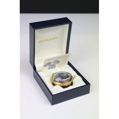 87 - Two boxed Moorcroft pottery vases to include a Carousel squat vase (11cm tall), and a Hypericum balu... 