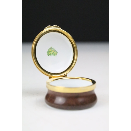 87 - Two boxed Moorcroft pottery vases to include a Carousel squat vase (11cm tall), and a Hypericum balu... 