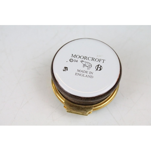 87 - Two boxed Moorcroft pottery vases to include a Carousel squat vase (11cm tall), and a Hypericum balu... 