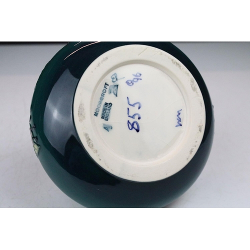 87 - Two boxed Moorcroft pottery vases to include a Carousel squat vase (11cm tall), and a Hypericum balu... 