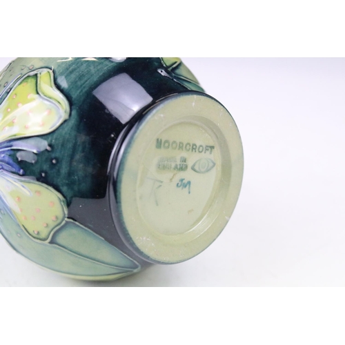 87 - Two boxed Moorcroft pottery vases to include a Carousel squat vase (11cm tall), and a Hypericum balu... 