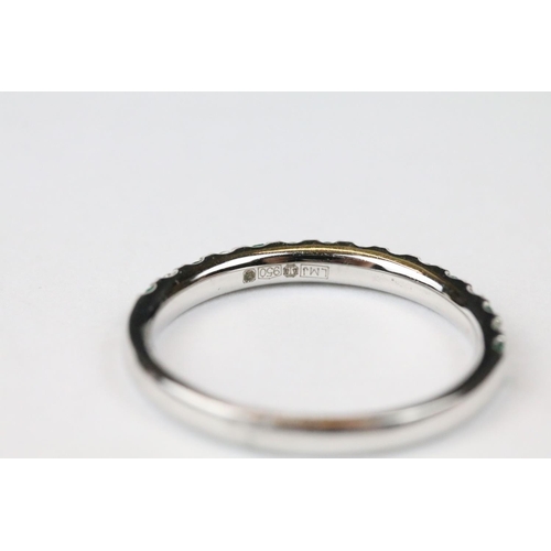 261 - Platinum, emerald and diamond half eternity ring, approx. 1/2 carat