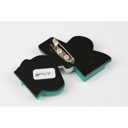 264 - Two Lea Stein style brooches in the form of Art Nouveau ladies.