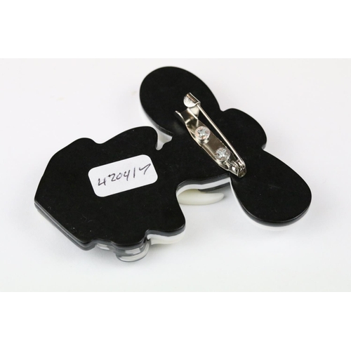 264 - Two Lea Stein style brooches in the form of Art Nouveau ladies.