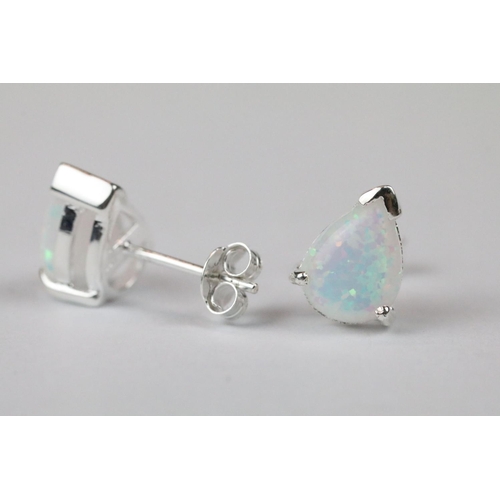 269 - Pair of silver and pear shaped opal stud earrings