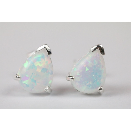 269 - Pair of silver and pear shaped opal stud earrings