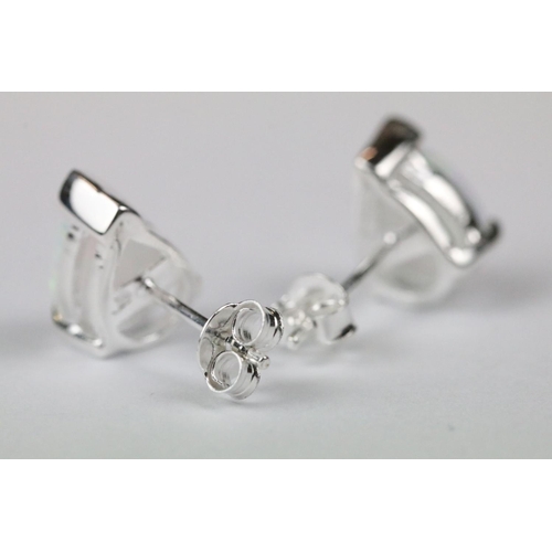 269 - Pair of silver and pear shaped opal stud earrings