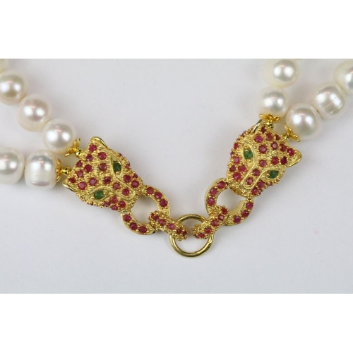 276 - Double row of fresh water pearls with panther head clasp set with rubies