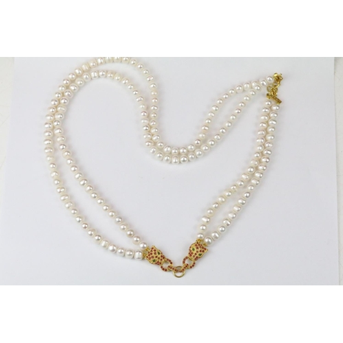 276 - Double row of fresh water pearls with panther head clasp set with rubies