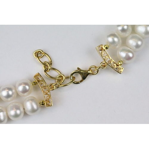 276 - Double row of fresh water pearls with panther head clasp set with rubies