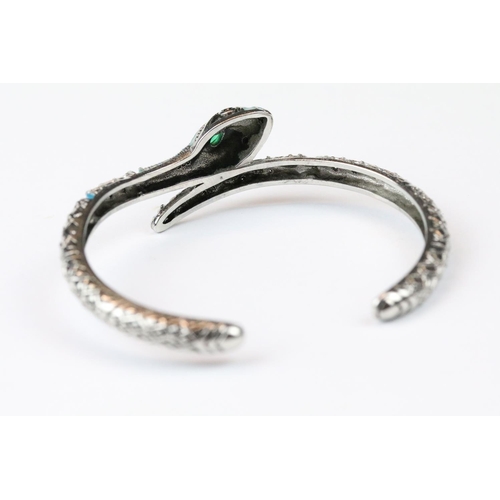 277 - A 925 sterling silver bangle in the form of a snake, marked 925 to the verso.