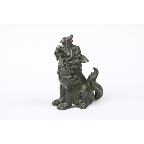 317 - A Chinese ornamental bronze dog of faux statue.