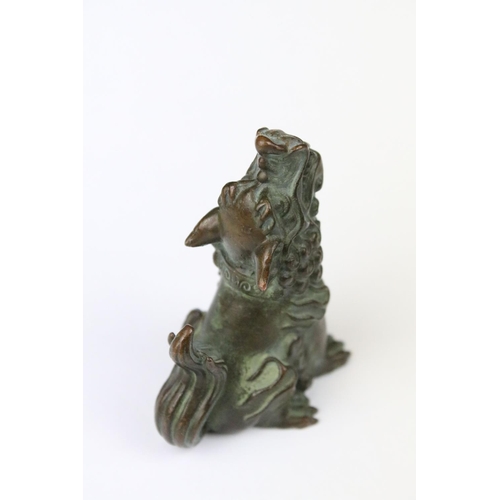 317 - A Chinese ornamental bronze dog of faux statue.