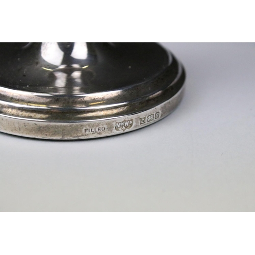 323 - A pair of fully hallmarked sterling silver candlesticks, assay marked for Birmingham.