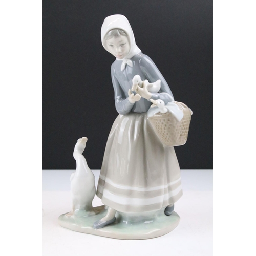 95 - Collection of 11 porcelain figures to include Lladro & Nao, featuring Lladro 4568 Shepherdess with D... 