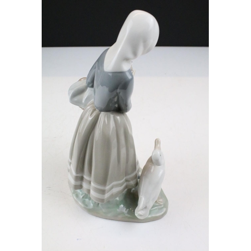95 - Collection of 11 porcelain figures to include Lladro & Nao, featuring Lladro 4568 Shepherdess with D... 