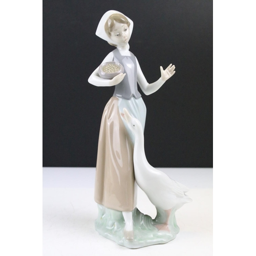 95 - Collection of 11 porcelain figures to include Lladro & Nao, featuring Lladro 4568 Shepherdess with D... 