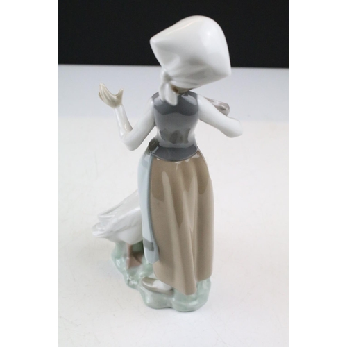 95 - Collection of 11 porcelain figures to include Lladro & Nao, featuring Lladro 4568 Shepherdess with D... 