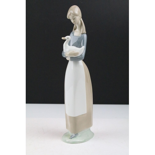 95 - Collection of 11 porcelain figures to include Lladro & Nao, featuring Lladro 4568 Shepherdess with D... 