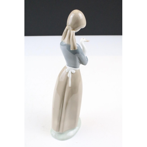 95 - Collection of 11 porcelain figures to include Lladro & Nao, featuring Lladro 4568 Shepherdess with D... 