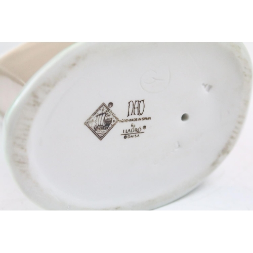 95 - Collection of 11 porcelain figures to include Lladro & Nao, featuring Lladro 4568 Shepherdess with D... 