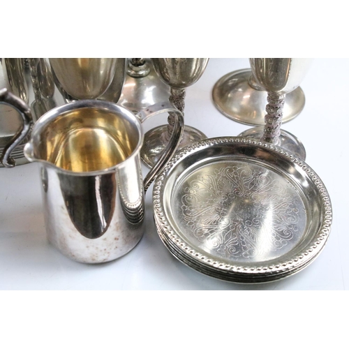 463 - Collection of silver plate to include a set of goblets with moulded stems, napkin rings, taste vin, ... 
