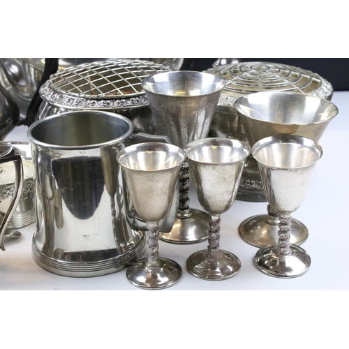 463 - Collection of silver plate to include a set of goblets with moulded stems, napkin rings, taste vin, ... 