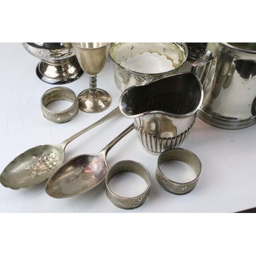 463 - Collection of silver plate to include a set of goblets with moulded stems, napkin rings, taste vin, ... 