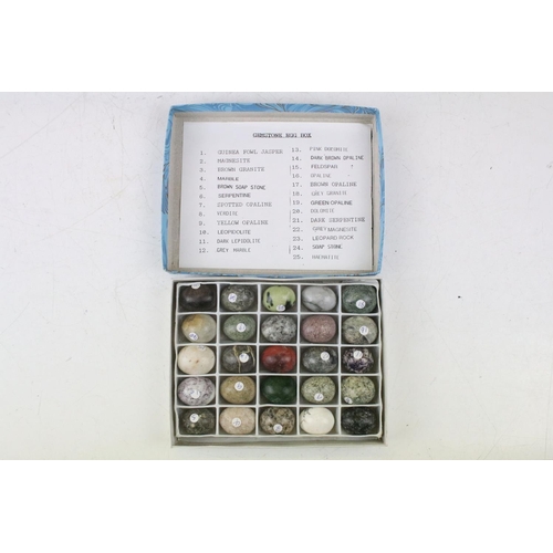 470 - A collection of 100 semi precious stone carved sample eggs housed within four boxes, together with a... 