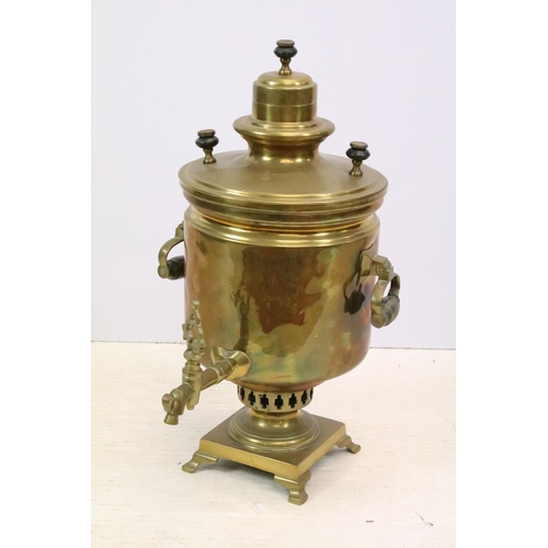 508 - Brass twin-handled samovar, with quatrefoil design pierced base, on four feet, Russian inscription a... 