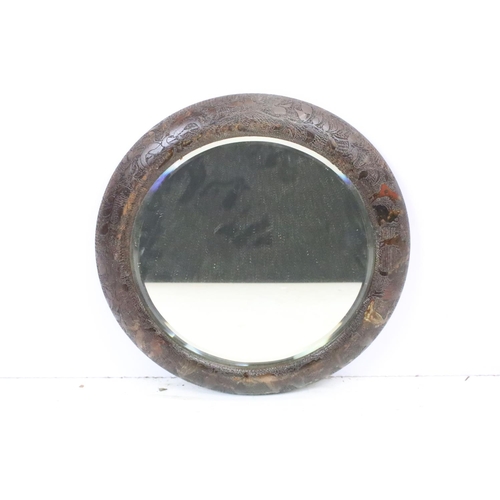 602 - Antique poker work circular wall mirror, the glass with bevelled edge, approx 38cm diameter
