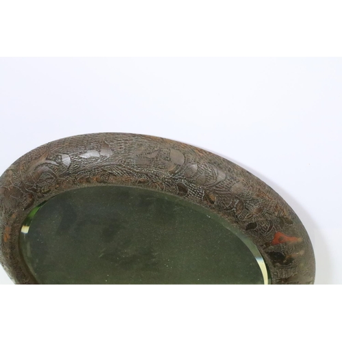602 - Antique poker work circular wall mirror, the glass with bevelled edge, approx 38cm diameter