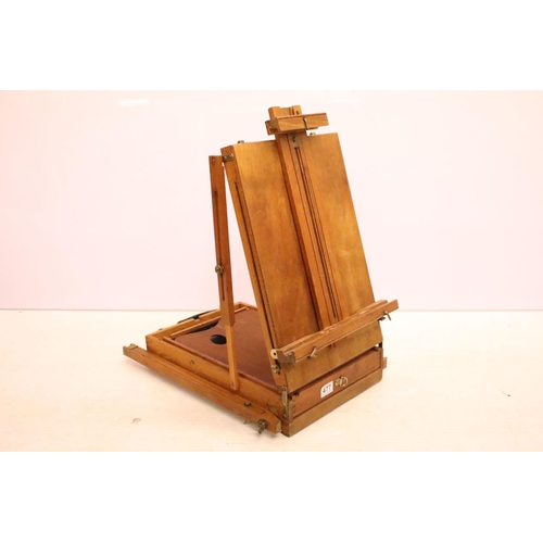 477 - Artists travelling easel / box, paint palette & compartments to interior, approx 55cm H x 38cm W (wh... 