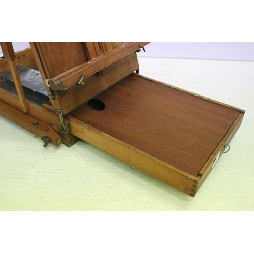 477 - Artists travelling easel / box, paint palette & compartments to interior, approx 55cm H x 38cm W (wh... 