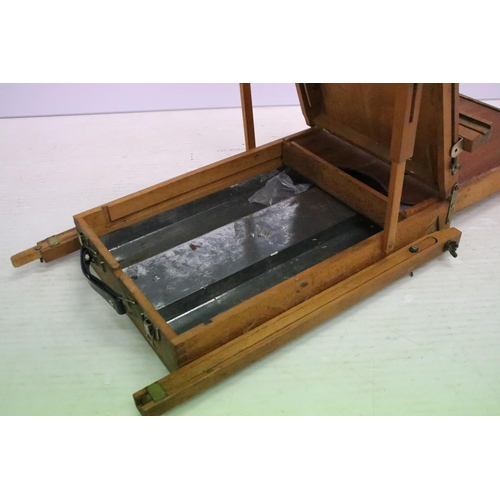 477 - Artists travelling easel / box, paint palette & compartments to interior, approx 55cm H x 38cm W (wh... 