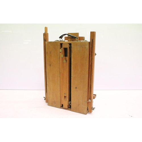 477 - Artists travelling easel / box, paint palette & compartments to interior, approx 55cm H x 38cm W (wh... 