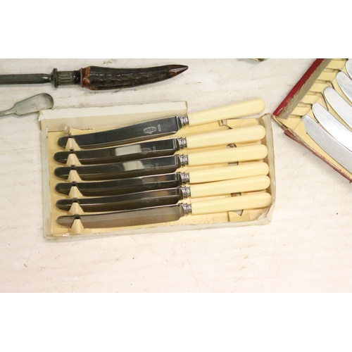 485 - Collection of silver plated flatware together with a pair of silver plated candlesticks, a quantity ... 