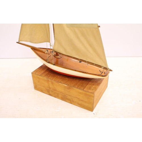 487 - Model sailing boat / pond yacht, with fitted wooden stand, 89cm high