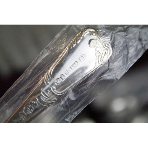 513 - K. Bright of Sheffield - An eight setting canteen of silver plated cutlery, together with a silver h... 