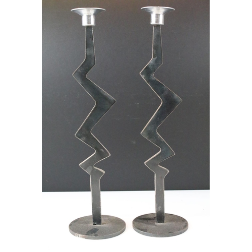 178A - Pair of cut metal candlesticks having zig zag shaped columns with sconces to top. Measures 37.5cm ta... 