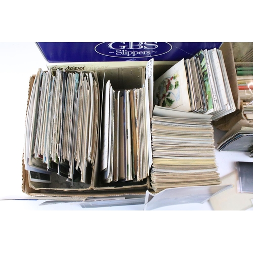 397 - Large collection of postcards housed within four boxes, early 20th century onwards, to include colou... 