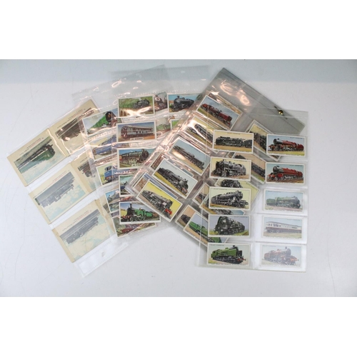 399 - Railwayana - A collection of vintage ephemera, books, booklets, cigarette cards (Wills+, 3 full sets... 