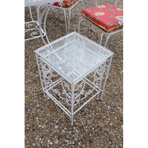 518 - White painted metal patio table set comprising a glass topped table with eight chairs and two glass ... 