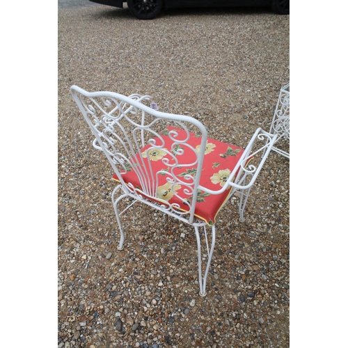 518 - White painted metal patio table set comprising a glass topped table with eight chairs and two glass ... 