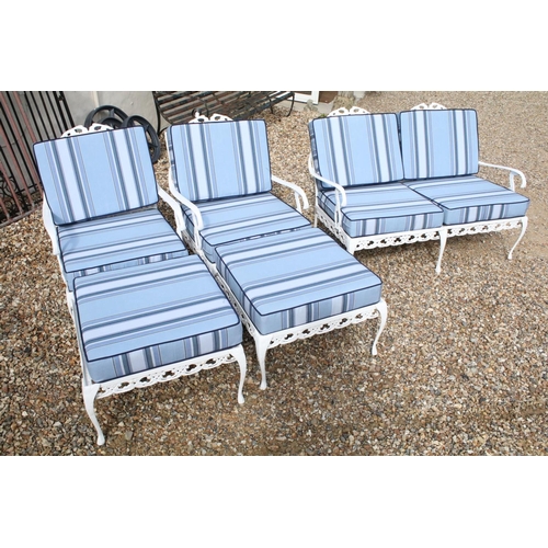519 - White painted cast metal garden / patio sun lounger set comprising a twin seat (approx 123cm wide) a... 