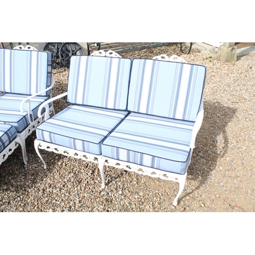 519 - White painted cast metal garden / patio sun lounger set comprising a twin seat (approx 123cm wide) a... 